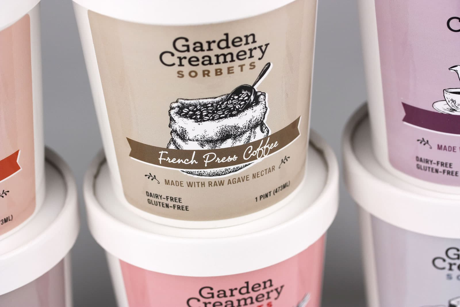 Garden Creamery Sorbets packaging in various flavours zoomed in on French Press Coffee.